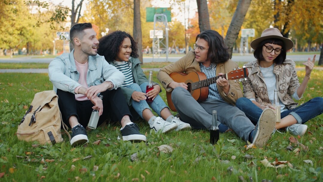 Small group of friends laughing together outdoors