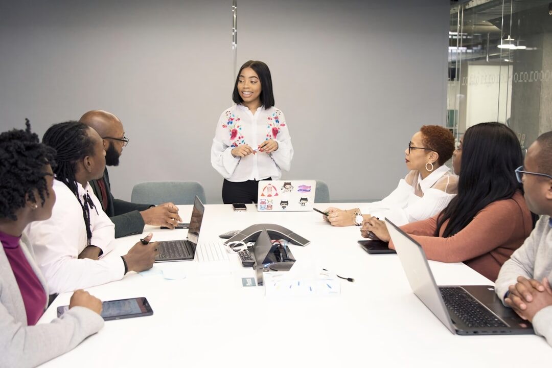 Woman confidently presenting to a small group