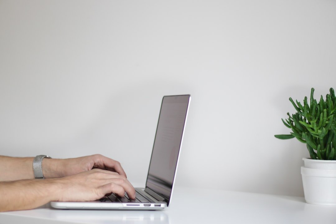 person typing on computer